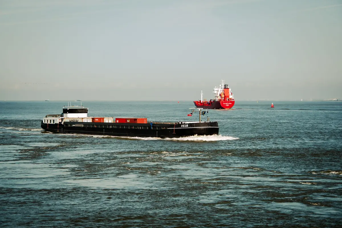 Container ships crossing open ocean water